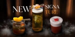 Promotional image for Davin Cafe's new signature drinks, showing an assortment of three different cocktails with creative garnishes.