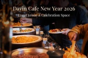 A buffet catering setup inside a New Year event venue, where guests enjoy a variety of dishes in a warm and social atmosphere, highlighting a well-organized celebration space ideal for corporate events, group gatherings, and New Year festivities