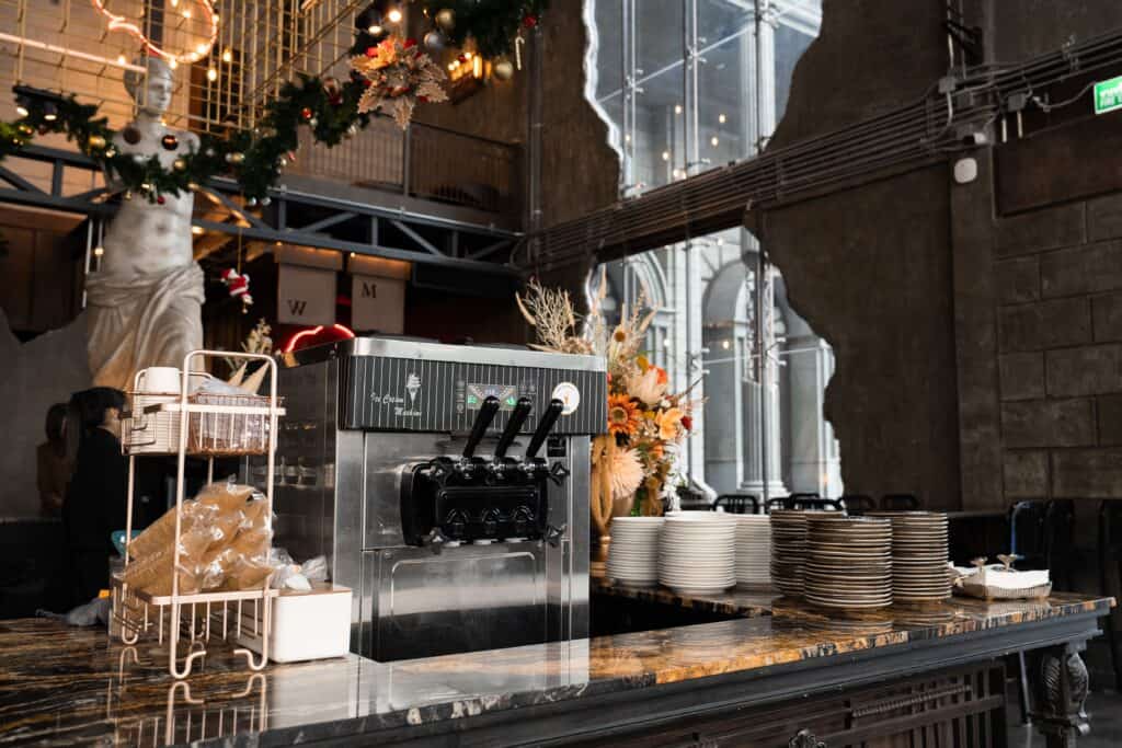 A dedicated beverage and dessert station at a restaurant catering event, fully equipped to support corporate functions and large-scale celebrations