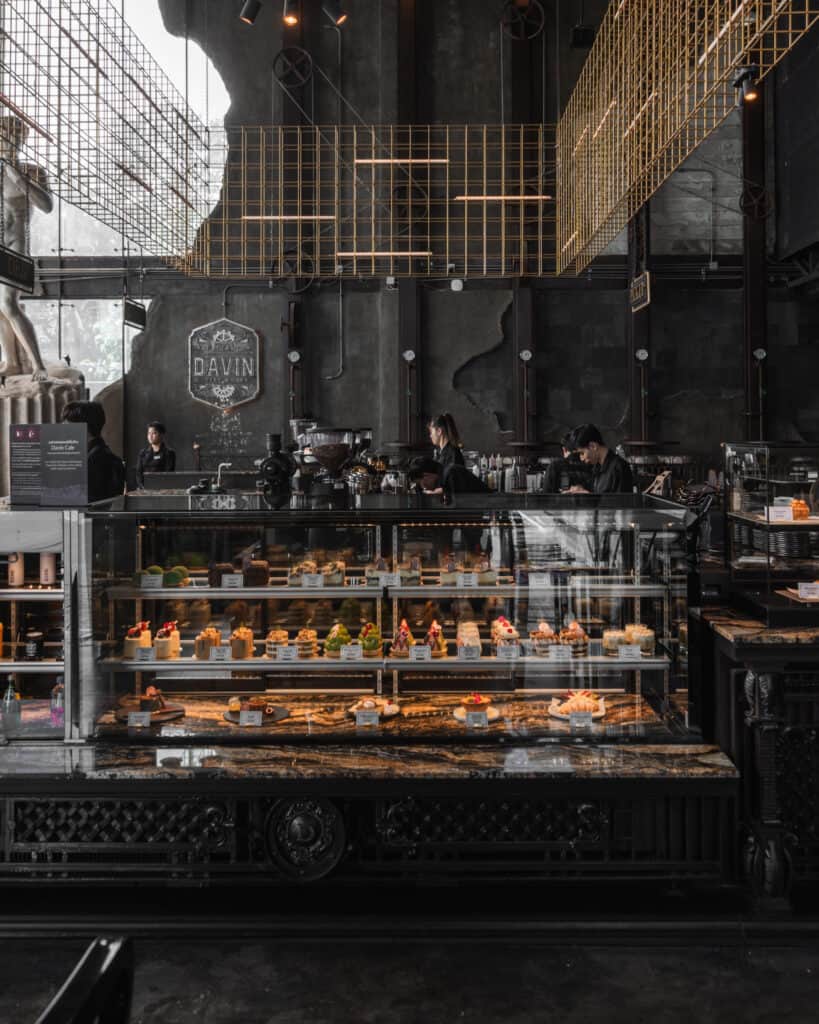 Near me café in Ramintra at Davin Cafe featuring a premium bakery counter and barista area with an industrial luxury interior