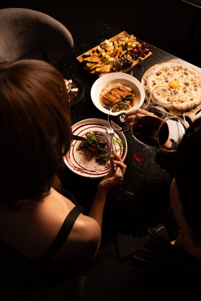 Valentine’s Day romantic dinner for a couple, enjoying a premium fine dining experience with warm lighting, wine, and an intimate atmosphere