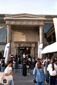 Davin Cafe entrance with crowd during The First Ultimate เที่ยวสุดโลก event, November 2025.