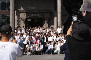 Davin Cafe event with large group of people, outdoor photo, July 2025.