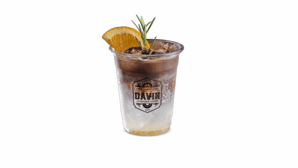 BLACK YUZU TONIC at DAVIN CAFE coffee shop Bangkok featuring espresso mixed with yuzu citrus and tonic soda, a refreshing sparkling signature drink in a trendy Bangkok coffee shop