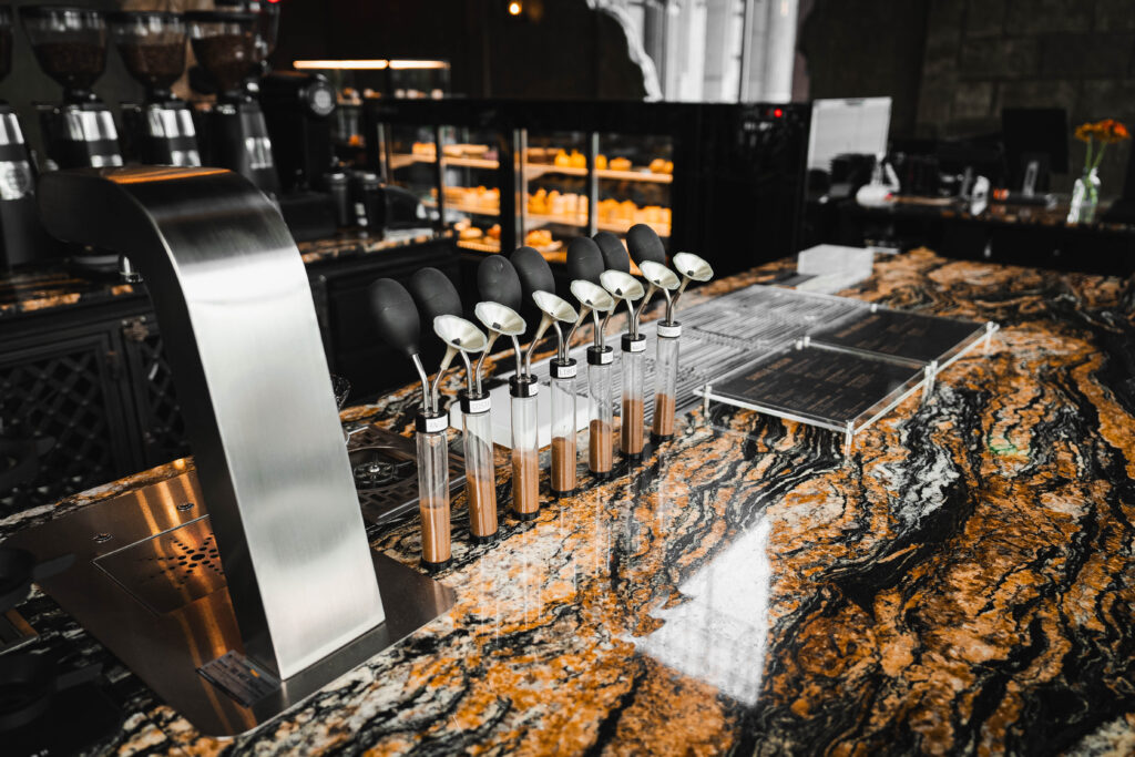A structured coffee tasting setup at Davin Cafe, featuring professional tools arranged on a premium counter, ideal for experiential workshops and interactive seminar sessions in Bangkok