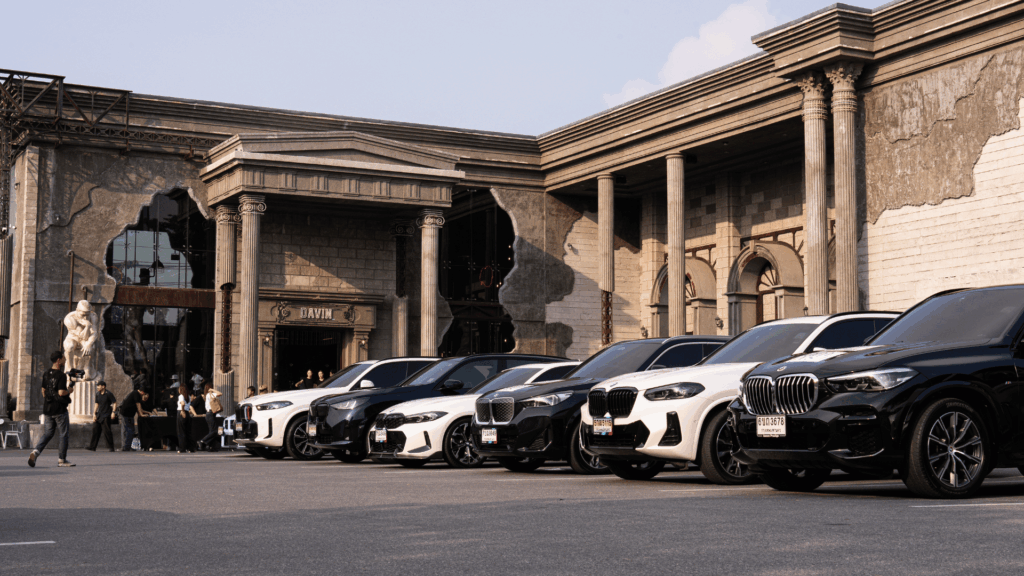 Front view of DAVIN CAFE premium event venue featuring luxury car lineup during The Car Lovers Drive Quest 2026, showcasing a high-end outdoor event venue ideal for automotive events and large-scale gatherings