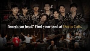 A lively seminar and workshop setting at Davin Cafe in Bangkok, featuring engaged participants in both seated sessions and interactive activities, highlighting its capability as a versatile corporate event venue