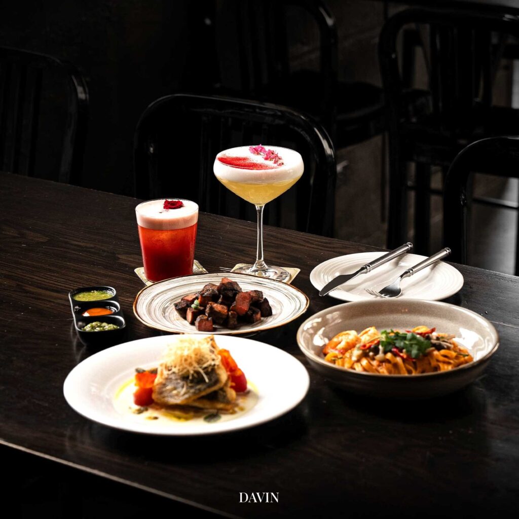Premium dining dishes and signature cocktails at DAVIN CAFE, a good atmosphere restaurant perfect for elegant dinner nights, social gatherings, and luxury dining experiences in the city center