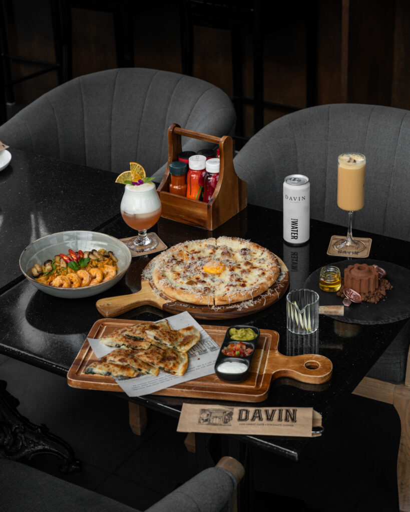 Gourmet dining platter featuring pizza and signature dishes at Davin Cafe