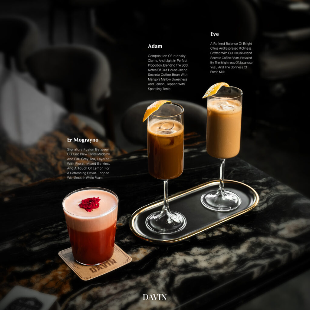 Signature drinks at Davin Cafe served on a marble counter inside a European-style cafe in Bangkok, featuring premium coffee creations and refined beverage presentation for a stylish, photo-friendly cafe experience.