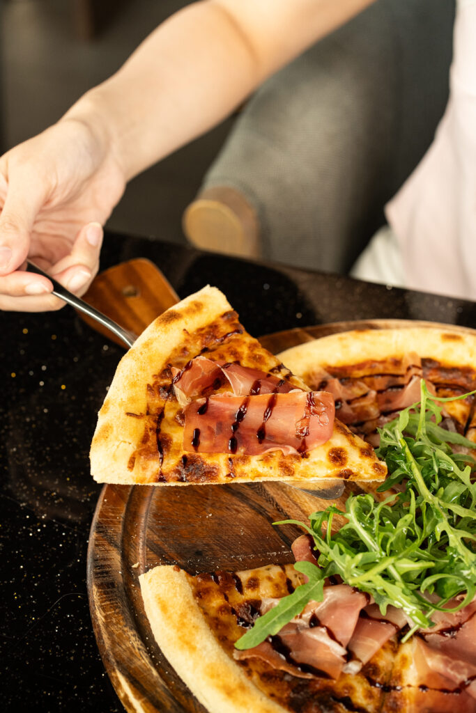Signature prosciutto pizza served at DAVIN CAFE, a premium Liap Duan restaurant featuring quality ingredients, chef-crafted flavors, and a distinctive dining experience in an elegant atmosphere