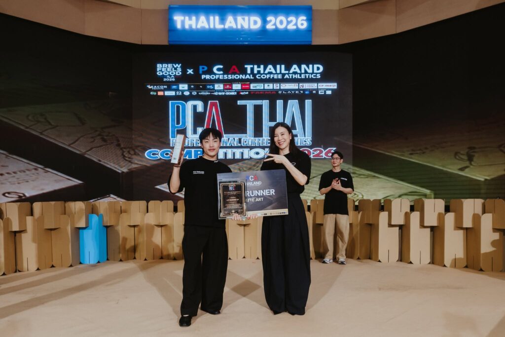 DAVIN CAFE representative receiving an award on stage at PCA Latte Art Thailand 2026, highlighting professional barista excellence, specialty coffee expertise, and national recognition in Thailand’s coffee industry