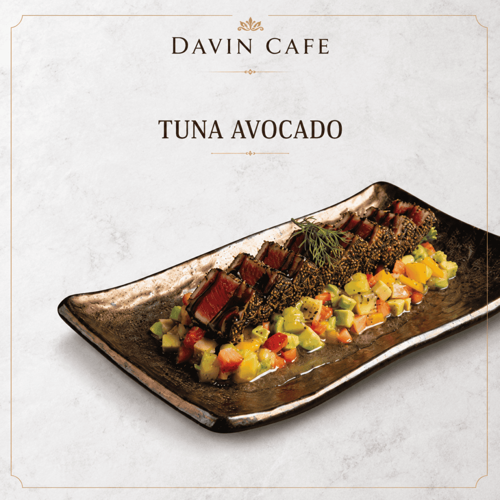 Tuna avocado dish at Davin Cafe featuring sesame-crusted seared tuna with avocado, mango, and tomato salsa, created as a fresh and refined lunch option for guests who want a lighter yet satisfying midday meal.