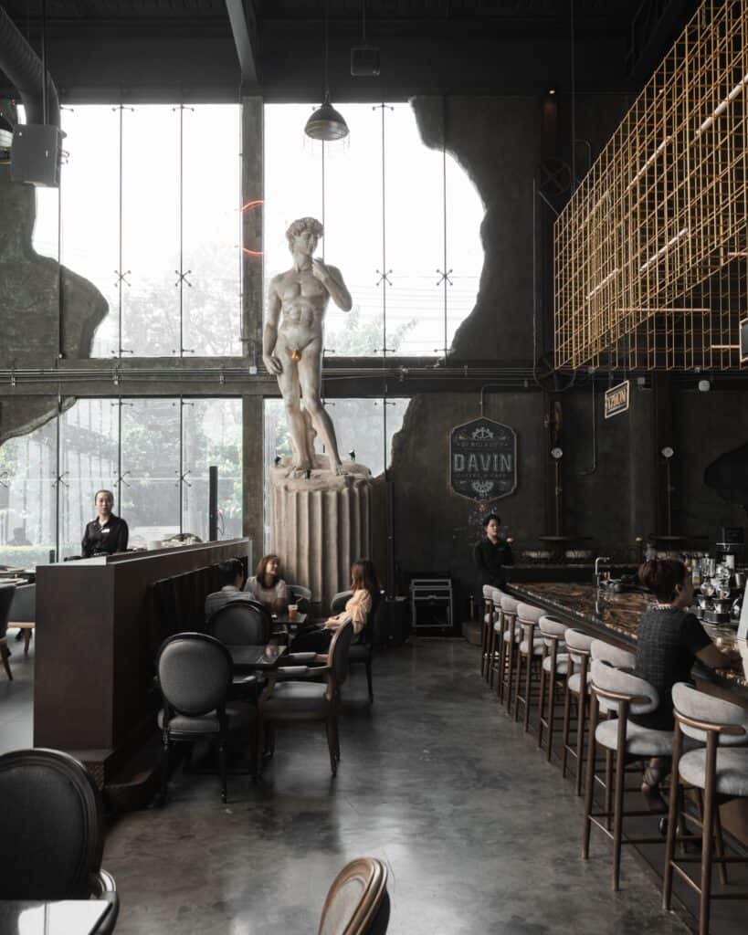 Popular cafe in Ramintra at DAVIN CAFE featuring a grand European-inspired interior, high ceilings, premium coffee bar, spacious seating, and one of Bangkok's most beautiful café photo spots.