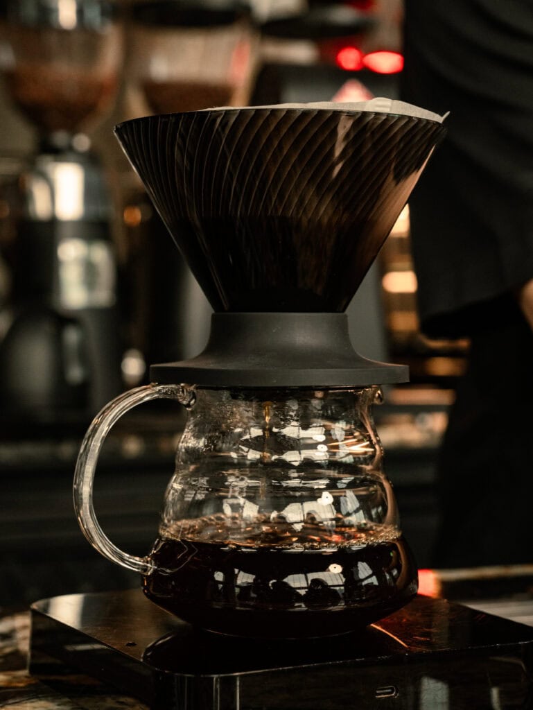 Panama Geisha drip coffee extracted through a paper filter into a glass server at DAVIN CAFE, highlighting its specialty coffee character
