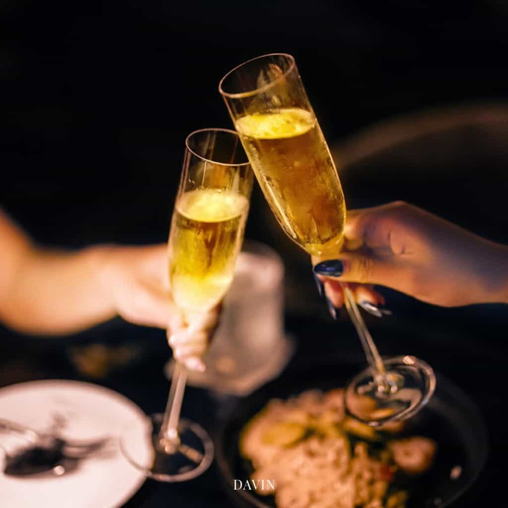 Ramintra restaurant at DAVIN CAFE featuring guests toasting during an elegant dinner, perfect for birthday celebrations, private gatherings, family dining, and special occasions in a European-inspired restaurant in Bangkok.