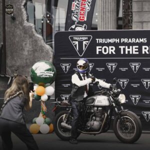 A biker elegantly posing on his motorcycle during the Distinguished Gentleman's Ride event at our meetup space in Bangkok.