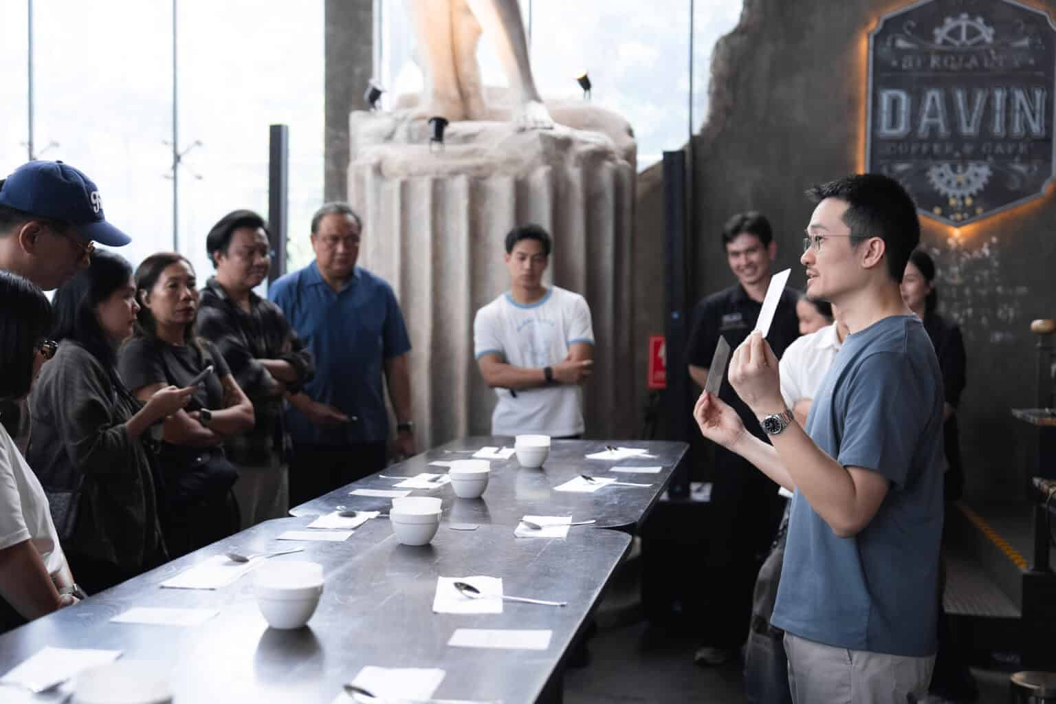 A coffee cupping workshop and tasting event hosted at Davin Cafe's indoor meetup space in Bangkok.