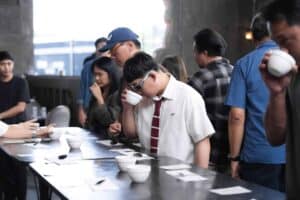 Guests participating in a coffee tasting event at Davin Cafe exhibition venue in Bangkok