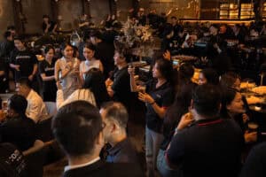 Corporate guests networking during a product launch event at Davin Cafe in Bangkok