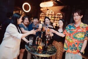Corporate guests celebrating during a product launch event at Davin Cafe in Bangkok