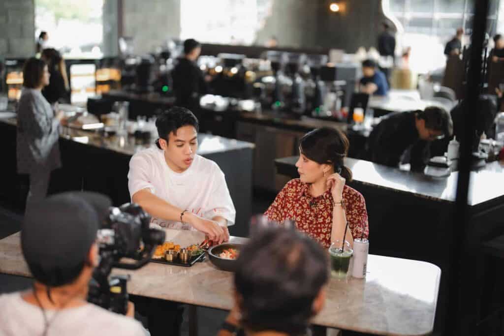 Commercial video shoot with camera crew filming dining content at DAVIN CAFE Bangkok