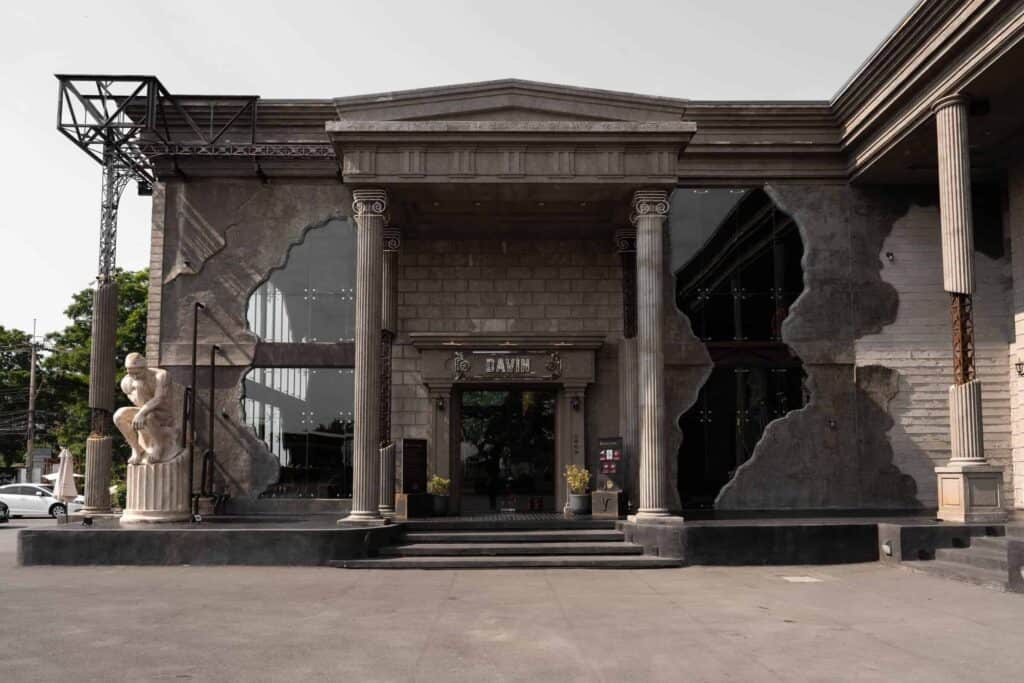 Grand European-style entrance with classical columns at Davin Cafe event venue in Bangkok