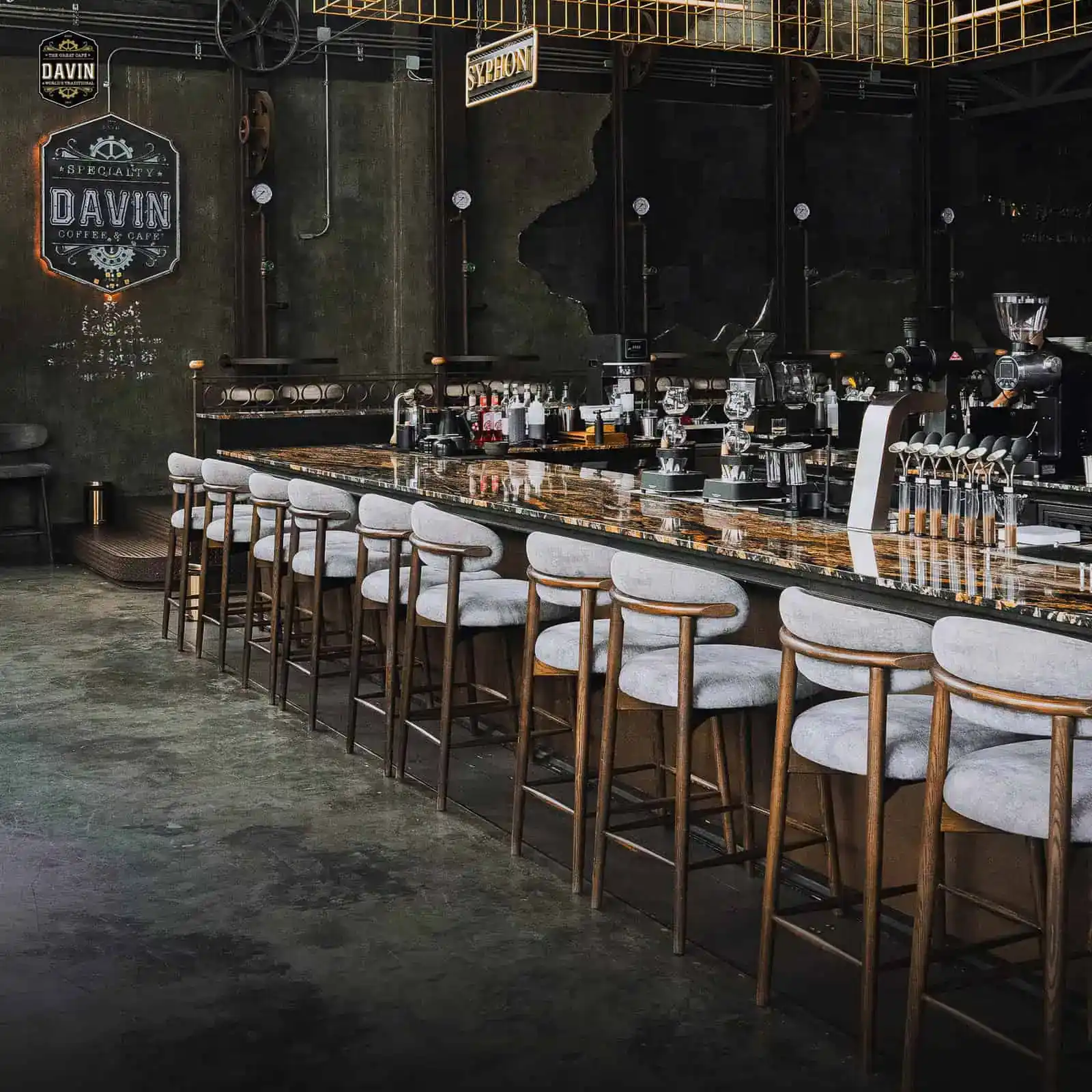Industrial-style bar and seating area at Davin Cafe, an event venue in Ramintra, Bangkok for meetings and private events
