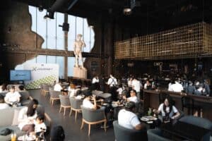 Guests seated comfortably in the stylish lounge area during an exclusive event at Davin Cafe, a unique corporate party venue in Bangkok.