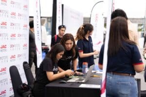 Registration team working at an outdoor product launch venue in Bangkok at Davin Cafe