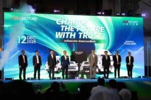Company executives standing on stage during a grand launch event at a premium corporate party venue in Bangkok.