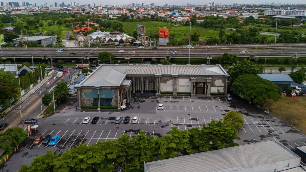 Aerial view of Davin Cafe exhibition venue in Bangkok with a large outdoor parking and event area