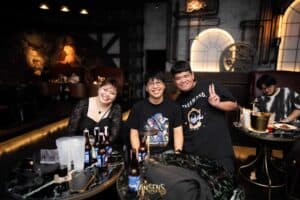 Happy friends enjoying a fun night out together at a table in our vibrant meetup space in Bangkok.