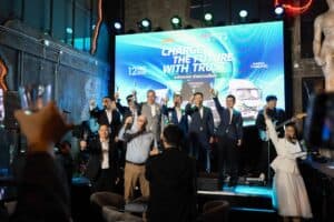 Executives making a champagne toast on stage during the JAC Motors launch at Davin Cafe, a premium event space rental in Bangkok.