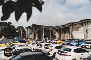 A massive gathering of Civic Type R cars filling the expansive parking lot at Davin Cafe, a top meetup space in Bangkok.