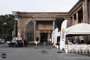 Davin Cafe's grand exterior setup with sponsor flags and registration tents, showcasing the outdoor event space rental in Bangkok.