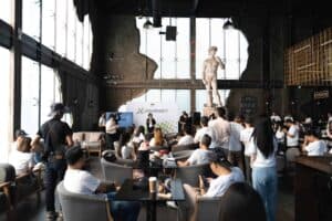 A speaker giving a presentation to an attentive audience before the celebration begins at our corporate party venue in Bangkok.