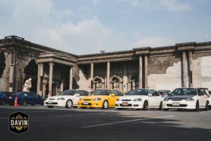 Civic Type R enthusiasts displaying their sports cars at Davin Cafe's spacious outdoor meetup space in Bangkok.