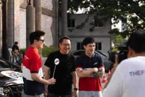 Television hosts enjoying a lively interview being filmed outside Davin Cafe, a preferred outdoor event space rental in Bangkok.